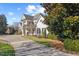 Charming two-story white home with a well-maintained lawn and mature landscaping at 4708 Wynneford Way, Raleigh, NC 27614