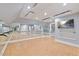 Spacious fitness room with mirrors, hardwood floors, and recessed lighting at 4708 Wynneford Way, Raleigh, NC 27614