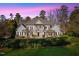 Elegant home with manicured lawn and impressive facade, showcasing classic design and curb appeal at 4708 Wynneford Way, Raleigh, NC 27614