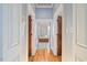 Hallway view looking into the main bathroom with tub at 4708 Wynneford Way, Raleigh, NC 27614