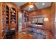Beautiful paneled home office with built in bookshelves and hardwood floors at 4708 Wynneford Way, Raleigh, NC 27614
