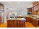 Gourmet kitchen with granite countertops, wood cabinets, center island and breakfast nook with large picture windows at 4708 Wynneford Way, Raleigh, NC 27614