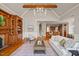 Spacious living room with hardwood floors, fireplace, chandelier, and open concept design to kitchen and dining area at 4708 Wynneford Way, Raleigh, NC 27614