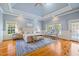 Spacious main bedroom with a tray ceiling and access to an outdoor patio at 4708 Wynneford Way, Raleigh, NC 27614