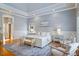 Spacious main bedroom with a tray ceiling, light grey paint and hardwood flooring at 4708 Wynneford Way, Raleigh, NC 27614