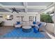 Comfortable outdoor living area with TV and modern furnishings at 4708 Wynneford Way, Raleigh, NC 27614