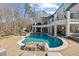 Backyard pool with a slide and spacious patio area at 4708 Wynneford Way, Raleigh, NC 27614