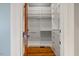 Walk-in closet with custom shelves and drawers to maximize organization at 4708 Wynneford Way, Raleigh, NC 27614