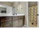 Bathroom featuring wood cabinets, marble counter tops, and decorative wall hangings at 50 Setter Ct, Angier, NC 27501