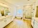 Luxurious bathroom featuring a soaking tub, walk-in shower, and dual vanities at 5161 Church Rd # 17, New Hill, NC 27562