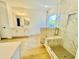 Bright bathroom with a walk-in shower featuring a glass door and a built in bench at 5161 Church Rd # 17, New Hill, NC 27562