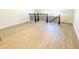Spacious loft area with wood-look floors and a decorative metal railing at 5161 Church Rd # 17, New Hill, NC 27562