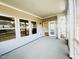 Covered patio with multiple windows and a sliding glass door leading inside at 5161 Church Rd # 17, New Hill, NC 27562
