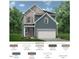 Charming two-story home with blue siding, gray accents, and a two-car garage at 60 Commons Cir, Clayton, NC 27520