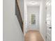 Bright hallway featuring a door with window and several entryways at 60 Commons Cir, Clayton, NC 27520