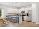 Modern kitchen features granite countertops, stainless steel appliances, and a breakfast bar at 60 Commons Cir, Clayton, NC 27520