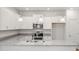 Modern kitchen with stainless steel appliances and white cabinets at 60 Commons Cir # 222, Clayton, NC 27520