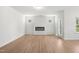 Bright living room with luxury vinyl flooring and electric fireplace at 60 Commons Cir, Clayton, NC 27520