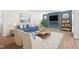 Bright open-concept living room with fireplace, stylish furniture, and dining area at 60 Commons Cir, Clayton, NC 27520