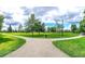 Community park featuring walking paths, mature trees, and expansive green spaces at 60 Commons Cir # 222, Clayton, NC 27520