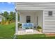 Cozy covered patio with comfortable seating, perfect for outdoor relaxation at 60 Commons Cir, Clayton, NC 27520