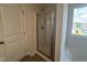Modern bathroom featuring a glass-enclosed shower with tile surround and natural light from window at 60 Commons Cir, Clayton, NC 27520