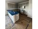 Kitchen with gray cabinets, hardwood floors, and blue countertop covers at 60 Commons Cir, Clayton, NC 27520