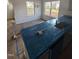 New kitchen with countertops protected by blue plastic at 60 Commons Cir, Clayton, NC 27520