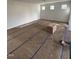 Bright and spacious living room with three windows at 60 Commons Cir, Clayton, NC 27520