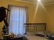 Cozy bedroom with a large window at 606 N Orange Ave, Dunn, NC 28334
