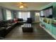 Spacious living room with updated floors, a large TV, and lots of seating at 606 N Orange Ave, Dunn, NC 28334