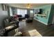 Spacious living room with updated floors, a large TV, and lots of seating at 606 N Orange Ave, Dunn, NC 28334