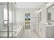 Bathroom featuring double sinks, separate shower, soaking tub, and a view to the main bedroom at 618 Tart Town Rd, Dunn, NC 28334