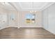 Bright and airy dining room features modern trim work, natural light, and hardwood style flooring at 618 Tart Town Rd, Dunn, NC 28334