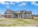 Charming single-story home boasts a two-car garage and inviting front entrance at 618 Tart Town Rd, Dunn, NC 28334