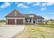 Beautiful home with an attached two-car garage and well-maintained lawn and landscaping at 618 Tart Town Rd, Dunn, NC 28334