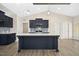 Modern kitchen island with stainless steel appliances, quartz countertops, and stylish backsplash at 618 Tart Town Rd, Dunn, NC 28334