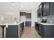 Modern kitchen with stainless steel appliances, quartz countertops, and stylish island at 618 Tart Town Rd, Dunn, NC 28334