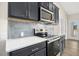 Modern kitchen with stainless steel appliances, quartz countertops, and stylish backsplash at 618 Tart Town Rd, Dunn, NC 28334