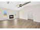 Spacious living room with fireplace, wood beams, and modern flooring at 618 Tart Town Rd, Dunn, NC 28334
