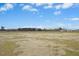 Wide open lot with beautiful sky and trees in the distance at 618 Tart Town Rd, Dunn, NC 28334