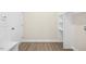 Mudroom featuring wood flooring, a closet with shelves, and an exterior door at 618 Tart Town Rd, Dunn, NC 28334