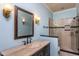 Elegant bathroom with stone countertop vanity, and glass-enclosed walk-in shower at 748 Weathergreen Dr, Raleigh, NC 27615