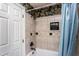 Upstairs tiled shower stall with a shower head and blue curtain at 748 Weathergreen Dr, Raleigh, NC 27615