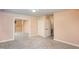 This cozy bedroom includes carpet, closet with mirrored doors, and access to an additional room at 748 Weathergreen Dr, Raleigh, NC 27615