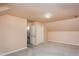 Carpeted bedroom with an overhead light, closet, and doorway leading to a stairway at 748 Weathergreen Dr, Raleigh, NC 27615