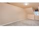 Bright bedroom with neutral carpet, a flush mount light, and a large window with shade at 748 Weathergreen Dr, Raleigh, NC 27615