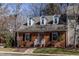 Charming brick home with dormer windows and beautifully landscaped front yard at 748 Weathergreen Dr, Raleigh, NC 27615