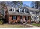 Beautiful brick home with well-maintained lawn and lovely architectural details at 748 Weathergreen Dr, Raleigh, NC 27615