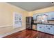 Bright kitchen with stainless steel appliances and well-maintained hardwood floors at 748 Weathergreen Dr, Raleigh, NC 27615